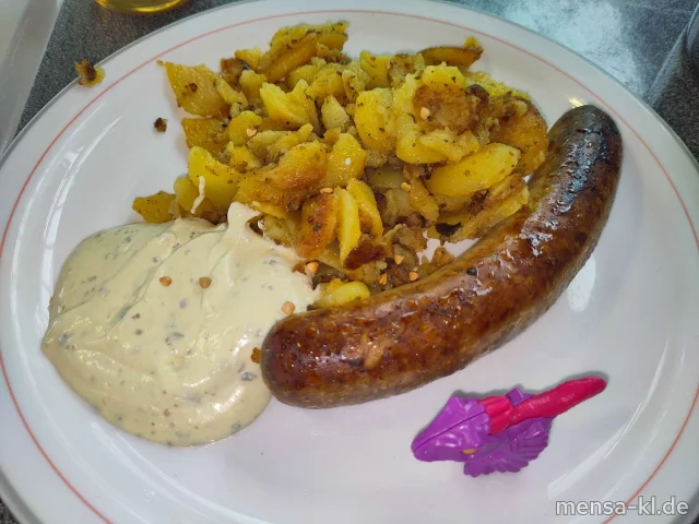 Bratwurst (Ei,Sf,R,S,W), Bratkartoffeln mit gerösteten Buchweizen und Waldsenf-Creme (La,Sf), dazu ein Beilagensalat nach Wahl
