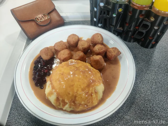 Geflügel-Köttbullar (Gl,Ei,G) mit Rahmsoße (Gl,La), Kartoffelpüree (5,La,Sw), Preiselbeeren (Sl) und Gurkensalat (1,3,5,Ei,La,Sw,Sf)