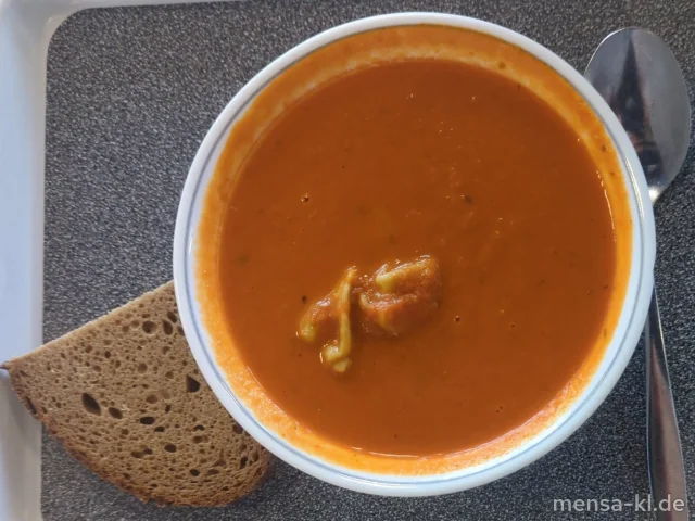 Tomatencremesuppe (Gl,Sl), dazu eine Scheibe Bauernbrot (Gl)