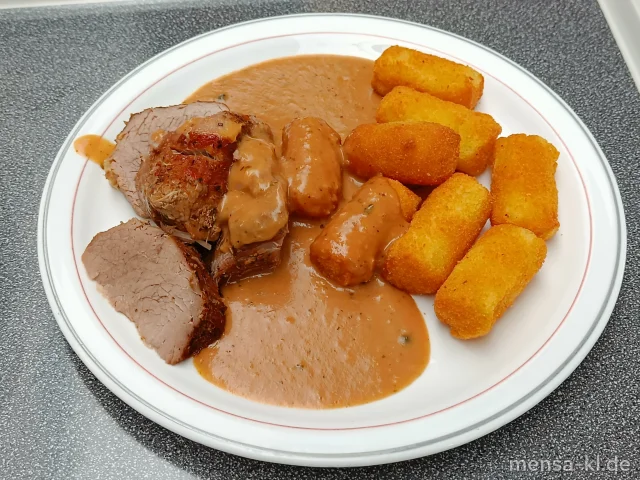 Kalbsbraten (K) mit Rahmsoße (Gl,La,Sf) und Kroketten (Gl), dazu einen Beilagensalat nach Wahl