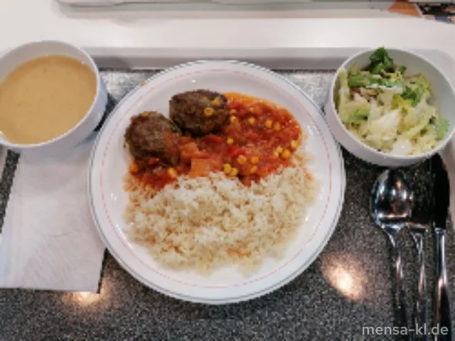 Zwei Köfta (Rinderhacksteak mit Gemüse und Hirtenkäse) (Gl,Ei,La,R) mit Pusztasoße (9,Sl), Reis und Salat