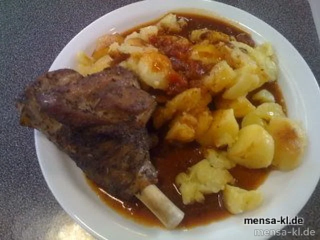 Lamm-Haxe "Provencial" (4) mit Tomaten-Kräutersoße und gebackenen Kartoffeln