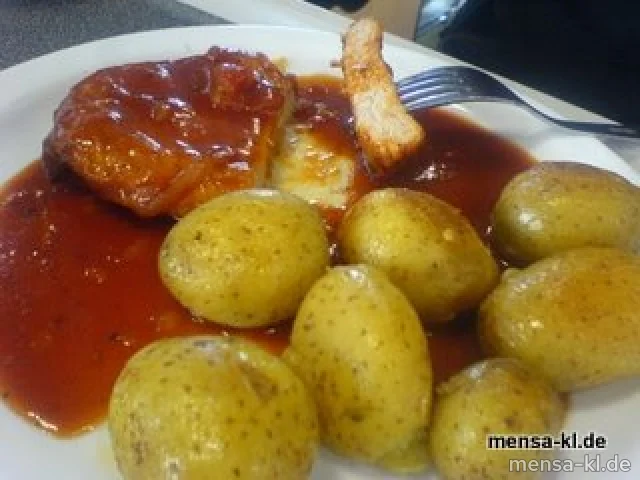Schweinerückensteak "Provencial" mit gebackenen Kartoffeln und grünen Bohnen