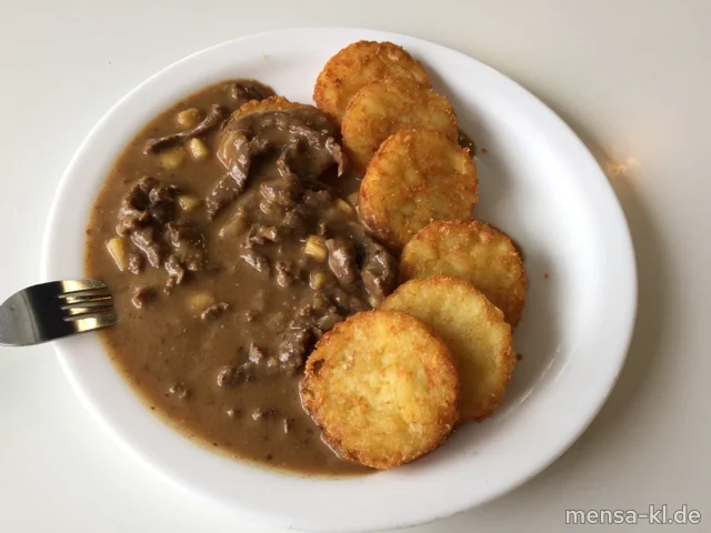 Rindergeschnetzeltes in Calvados-Senfsoße (Gl,La,Sf,A,R) mit Rösti und Mandel-Broccoli (1,Nu,La)
