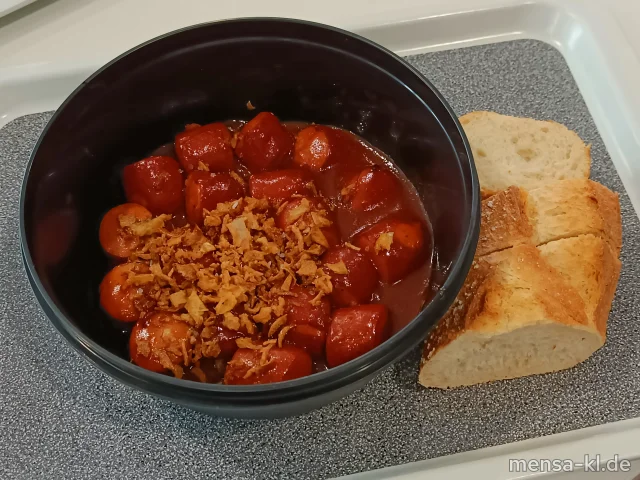 Currywurst C4PU mit Röstzwiebeln (1,2,3,8,Gl,Sf,R), dazu Baguette (Gl)