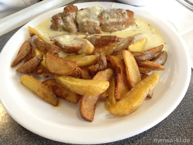 Schweinelendespieß (S) mit Kräuterbuttersoße und Potato Wedges