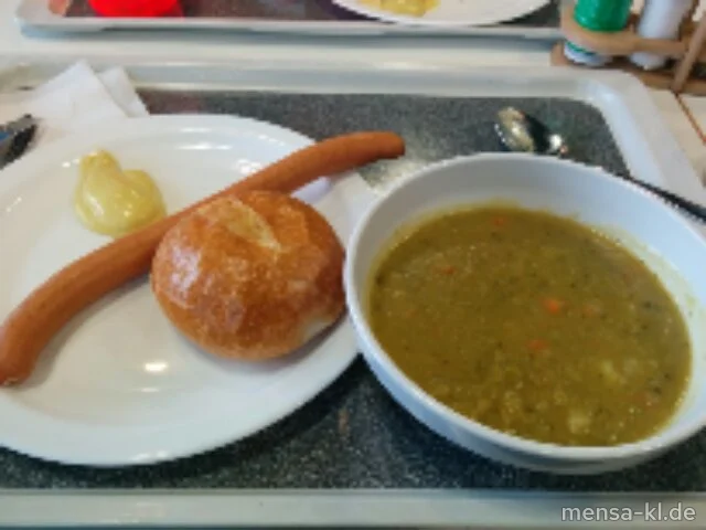 Erbseneintopf (1,5,La,Sw,Sl), mit einem Wiener Würstchen (2,4,8,Sf,S) und ein Bio-Weizenbrötchen (Gl,So)
